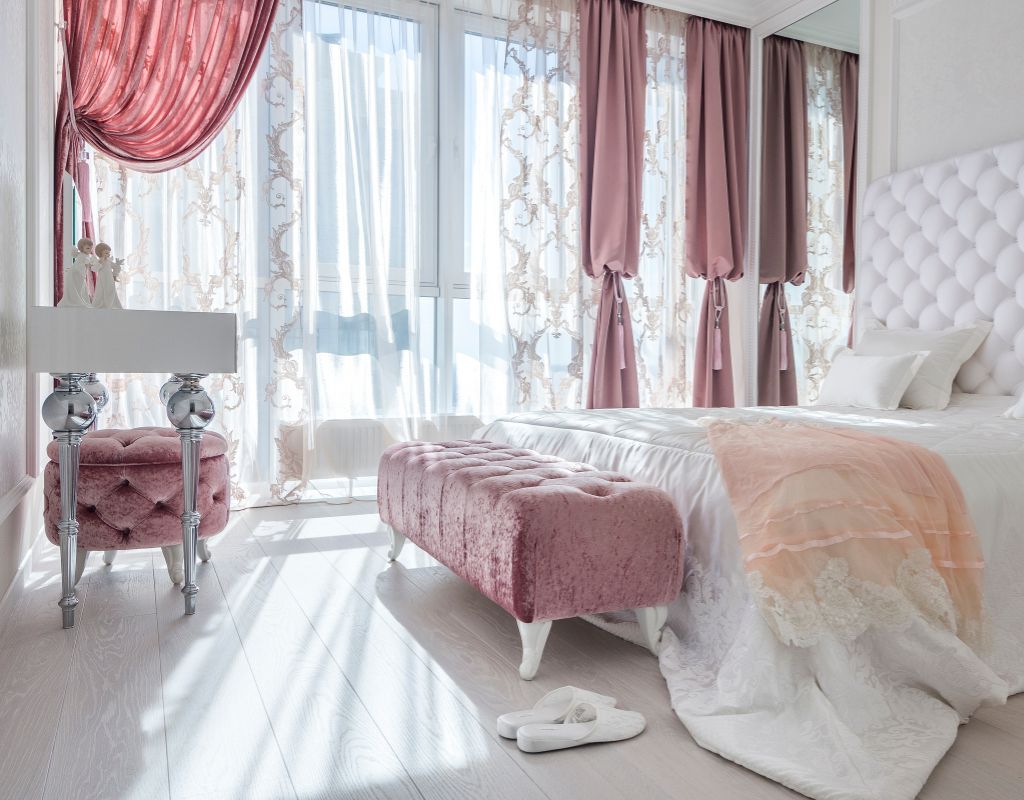 Bedroom with pink curtains and accessories